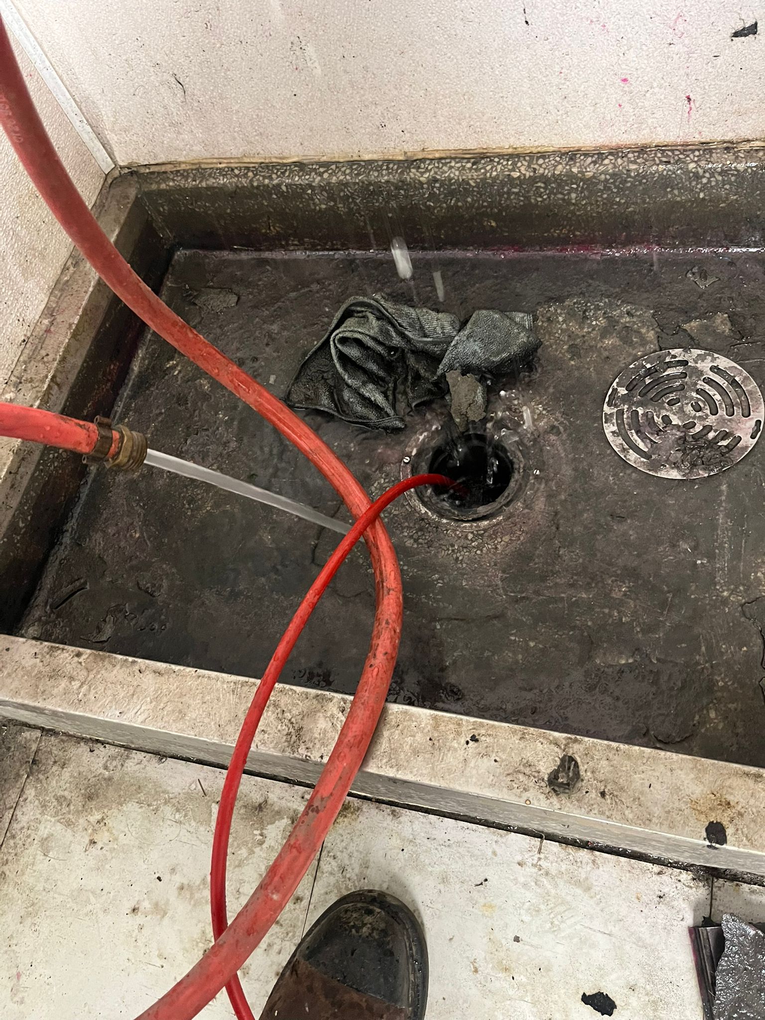 Debris removed from clogged mop sink drain line — commercial plumbing in Burnaby