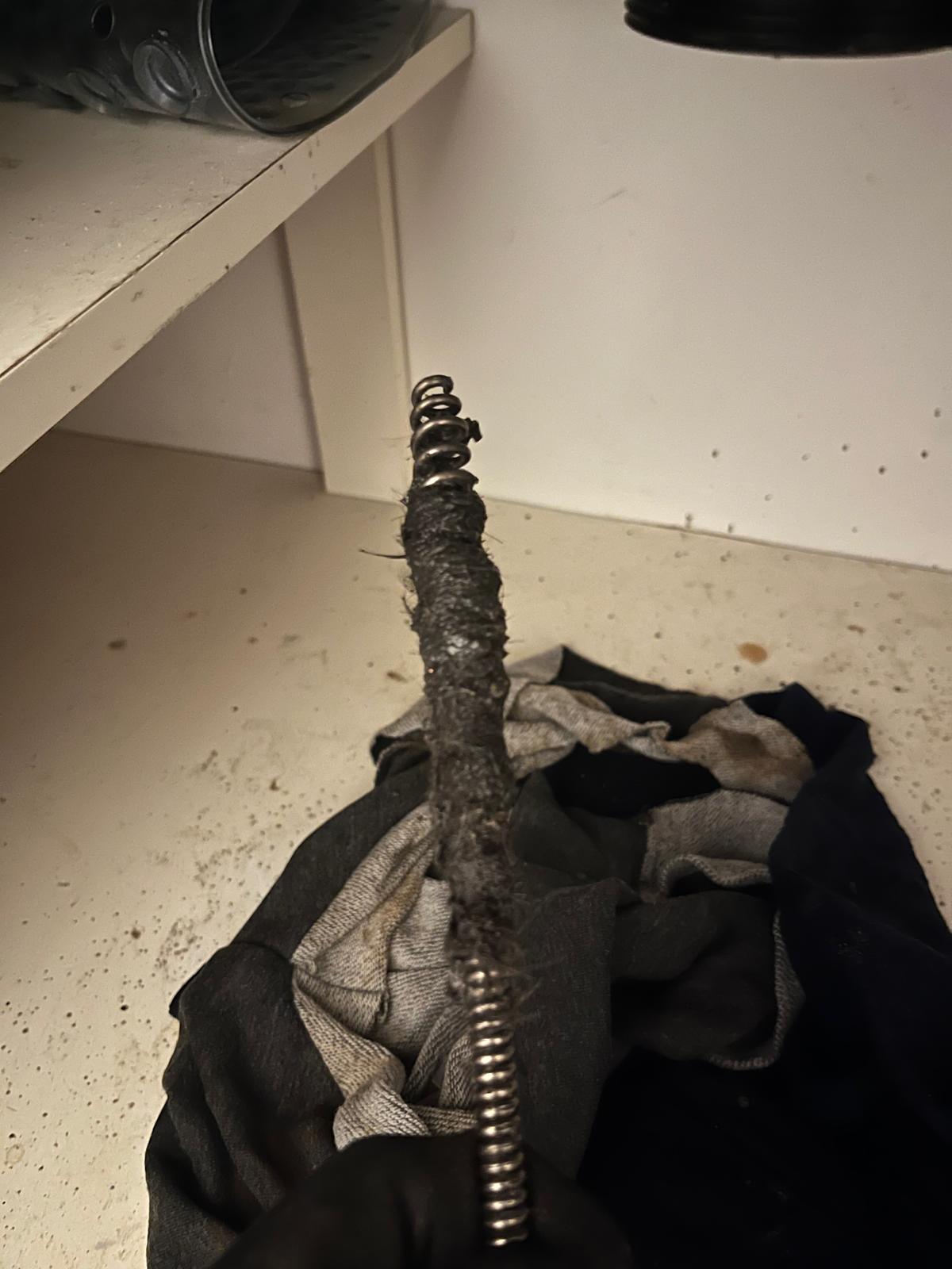 Accessing drain cleanout to clear blocked shared line during commercial plumbing in Abbotsford