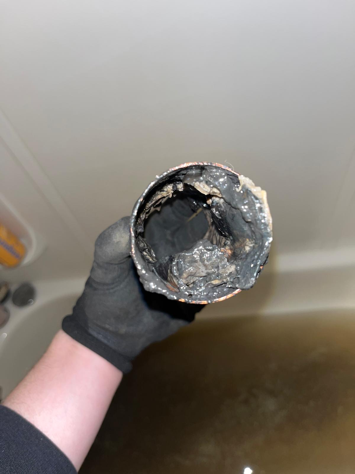 Drain snake machine set up to clear blockage during commercial plumbing in Abbotsford