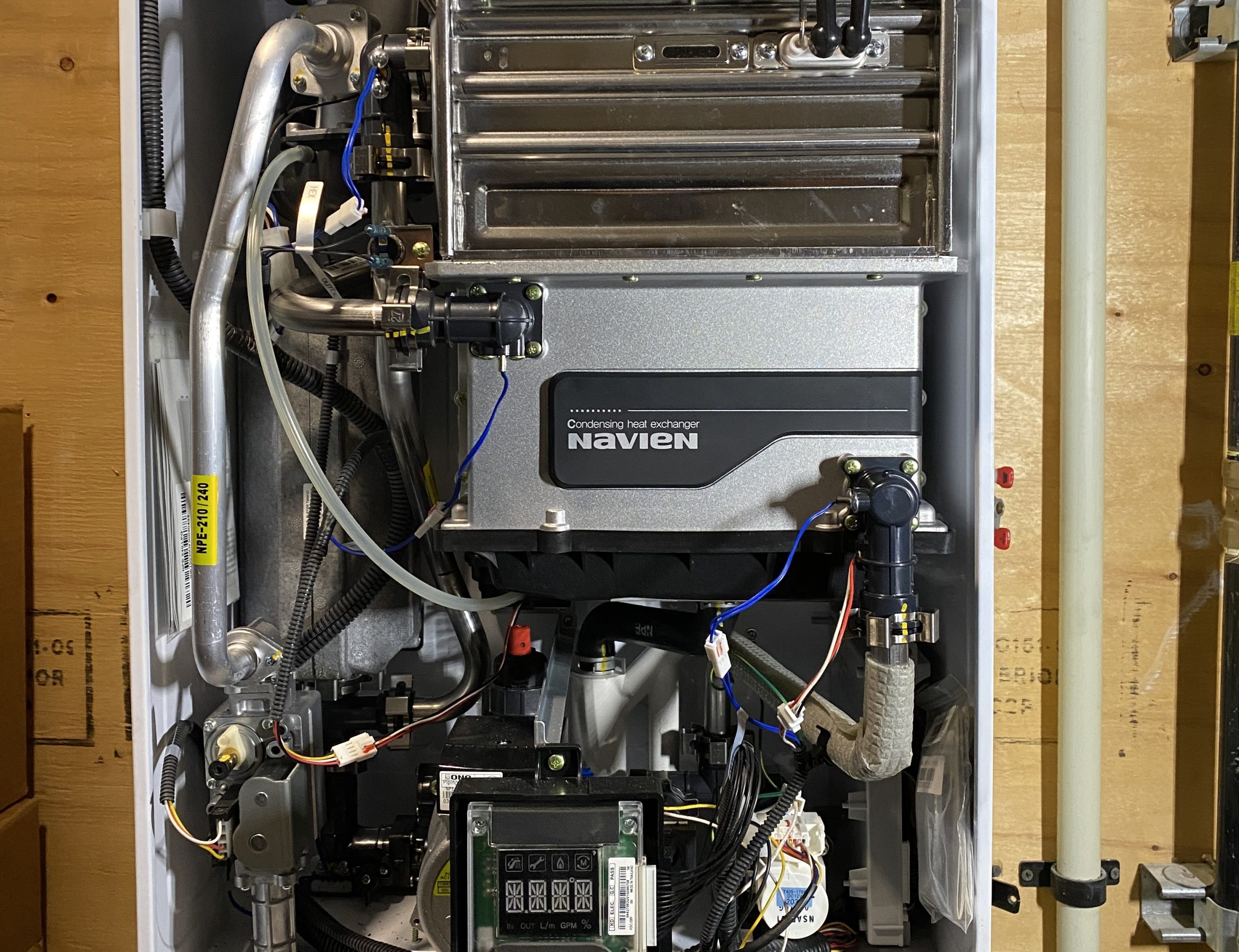 Interior view of Navien condensing heat exchanger during tankless water heater in Greater Vancouver