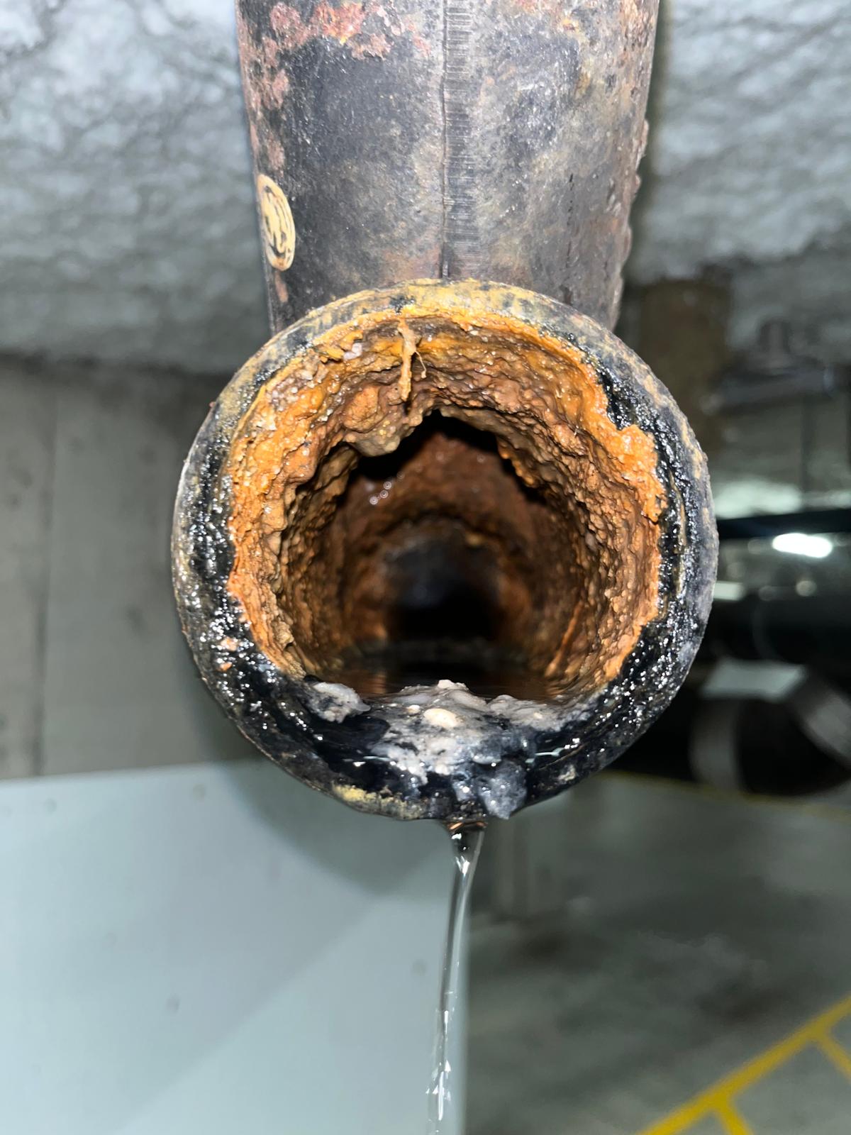 Parkade drainage line before major drain cleaning project — commercial plumbing in Richmond