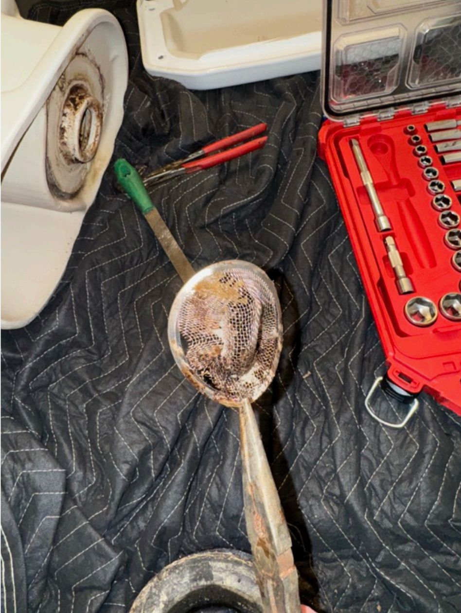 Toilet removed for inspection of clogged drain — drain cleaning in Vancouver