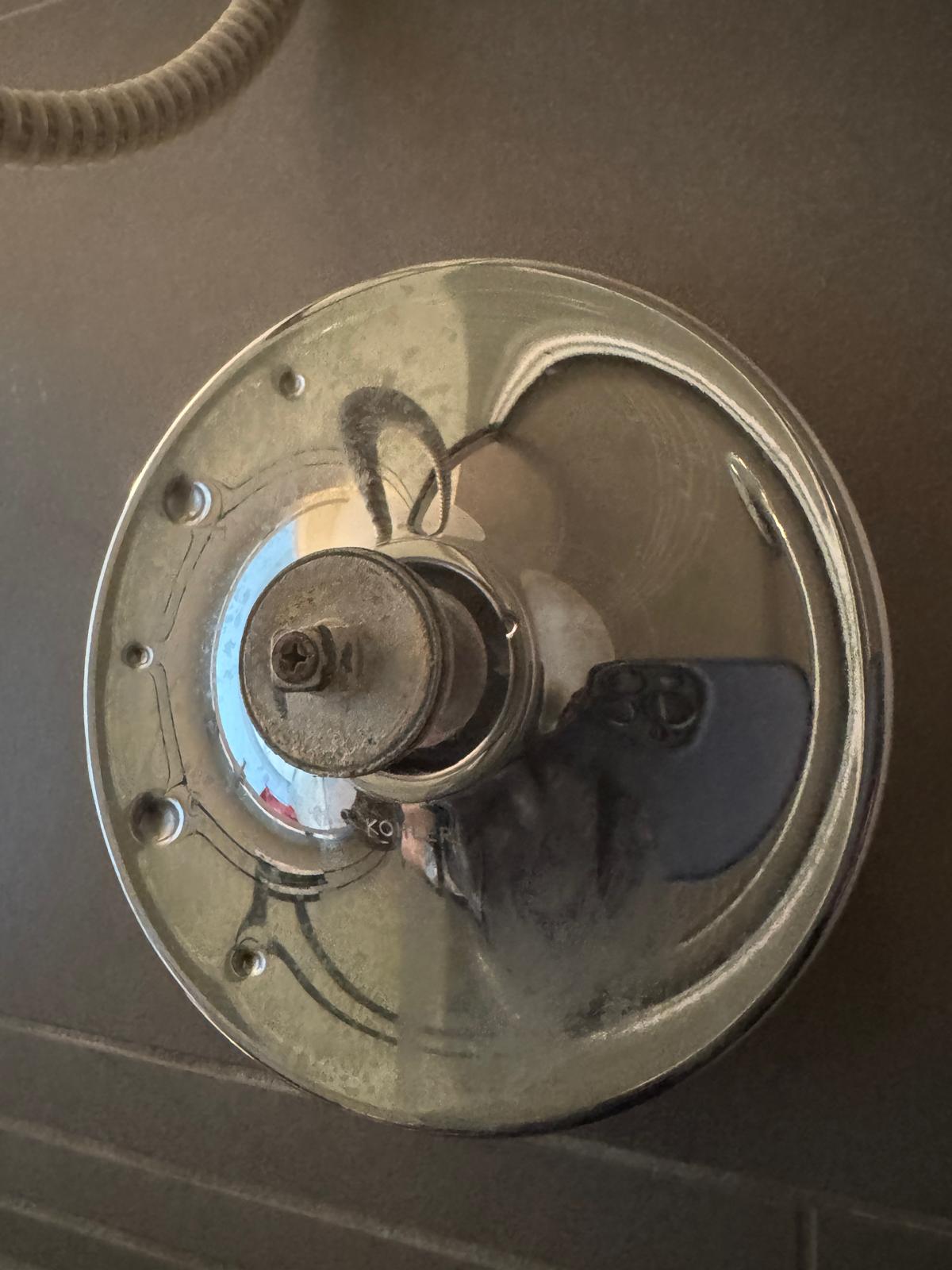 Cutting and removing tile to access the failed shower valve body in Langley for drain cleaning