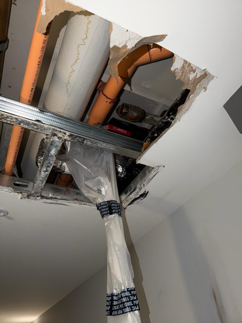 Richmond condo hot water main leak ceiling access opened